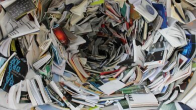 A whirlwind of books and papers creating a chaotic visual. Ideal for concepts of disorder or information overload.